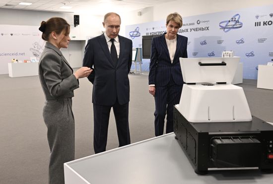 Russian President Vladimir Putin, accompanied by Sirius Federal Territory Chairman of the Board and Talent and Success Foundation head Elena Shmeleva and Moscow Institute of Physics and Technology (MIPT) senior researcher Elizaveta Mochalova, tours an exhibition as part of the 3rd Young Scientists Congress at the Sirius Park of Science and Art in Krasnodar region, Russia. Location: Russia, Federal territory 'Sirius'. Author: Kirill Zykov. Russia Putin Young Scientists Congress