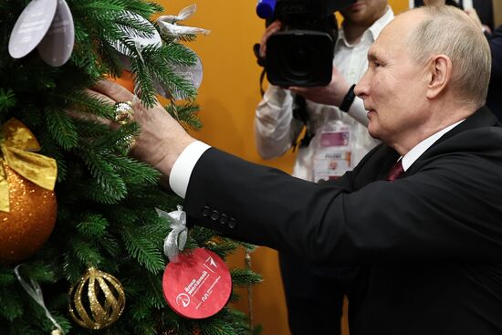 President Vladimir Putin takes part in Christmas Tree of Wishes charity campaign