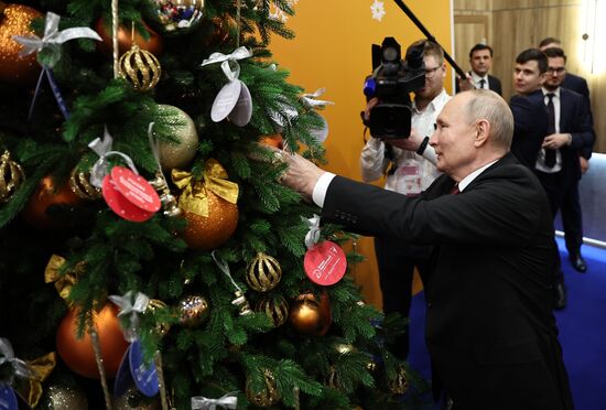President Vladimir Putin takes part in Christmas Tree of Wishes charity campaign