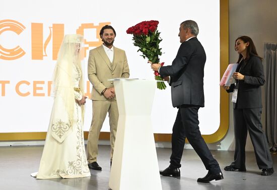 International RUSSIA EXPO forum and exhibition. Republic of North Ossetia - Alania Day. Pavilion No. 75, Room A. Traditional Ossetian wedding. Bride and groom: Anzhelika Kardanova and Konstantin Khetagurov; Sergei Menyailo, Head of the Republic of North Ossetia-Alania (right). Location: Russia, Moscow. Author: Ilya Pitalev/Sputnik. RUSSIA EXPO. Republic of North Ossetia - Alania Day