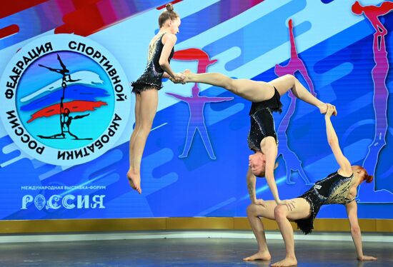 International RUSSIA EXPO forum and exhibition. Russian national acrobatics team's show. Champions of Russia, winners of international competitions.
Amina Madenova, Ivanna Melnikova, Sofya Fedorova, silver medalists of the Russian championship, winners of national competitions. Location: Russia, Moscow. Author: Ramil Sitdikov/Sputnik. RUSSIA EXPO. Russian national acrobatics team