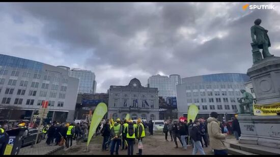 About 200 French farmers protest outside the European Parliament building in Brussels