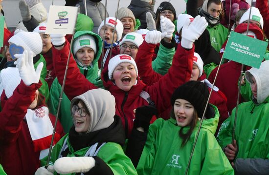 RUSSIA EXPO. Procession by tour guides of Rosmolodyozh's More Than Travel program and exhibition volunteers