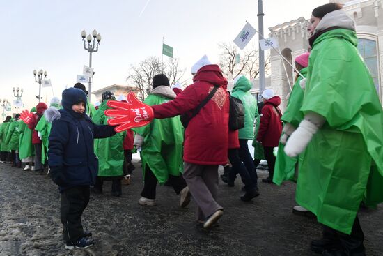 RUSSIA EXPO. Procession by tour guides of Rosmolodyozh's More Than Travel program and exhibition volunteers