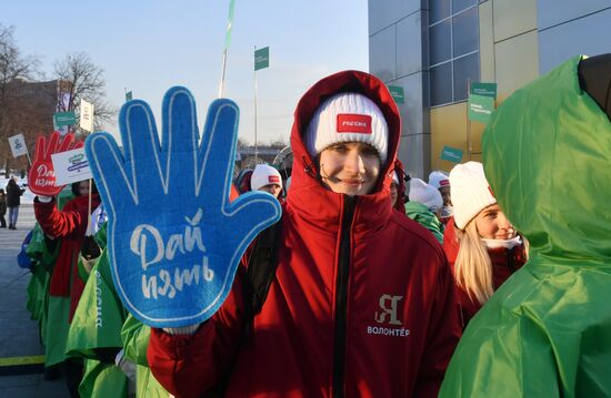 RUSSIA EXPO. Procession by tour guides of Rosmolodyozh's More Than Travel program and exhibition volunteers