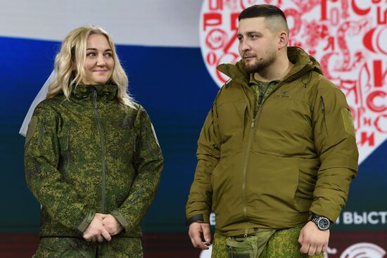 RUSSIA EXPO. Special military operation participants' marriage ceremony on anniversary of its launch