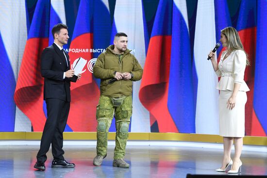 RUSSIA EXPO. Special military operation participants' marriage ceremony on anniversary of its launch