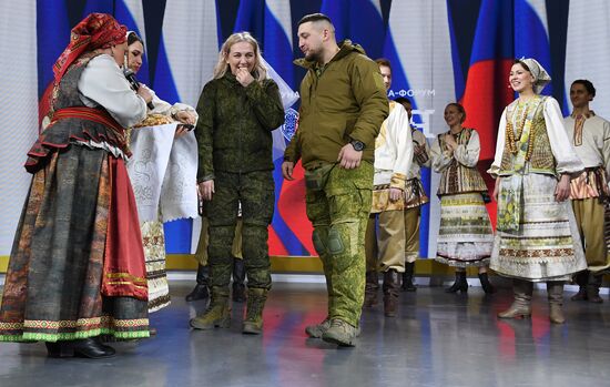 RUSSIA EXPO. Special military operation participants' marriage ceremony on anniversary of its launch