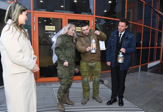 RUSSIA EXPO. Special military operation participants' marriage ceremony on anniversary of its launch