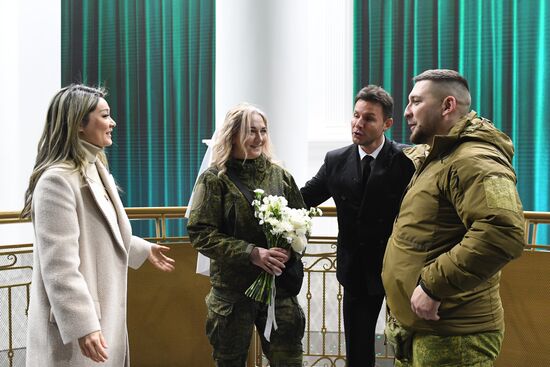 RUSSIA EXPO. Special military operation participants' marriage ceremony on anniversary of its launch