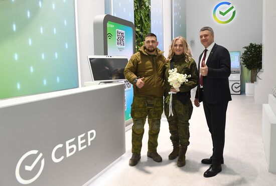 RUSSIA EXPO. Special military operation participants' marriage ceremony on anniversary of its launch