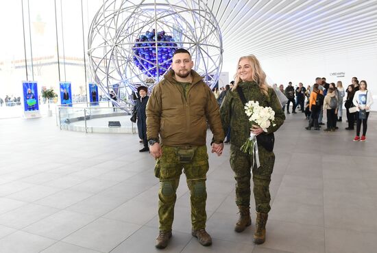 RUSSIA EXPO. Special military operation participants' marriage ceremony on anniversary of its launch