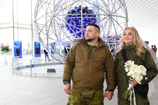 RUSSIA EXPO. Special military operation participants' marriage ceremony on anniversary of its launch