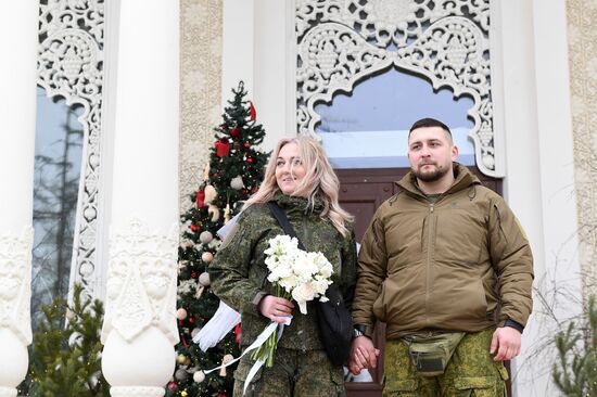 RUSSIA EXPO. Special military operation participants' marriage ceremony on anniversary of its launch