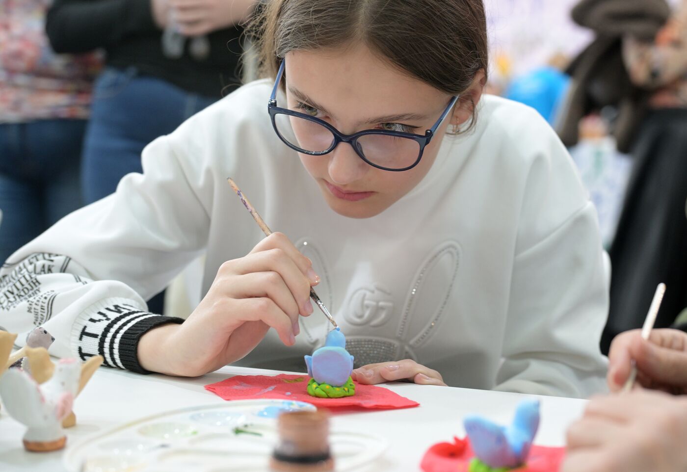 RUSSIA EXPO. Workshops on painting Romanov and Kovrov toys