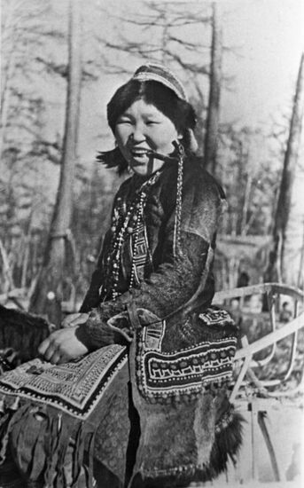 Evenki woman wearing ethnic clothes