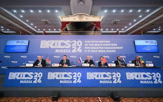 From right, Plenipotentiary Minister of the Ethiopian Embassy in Russia Elias Melaku Feleke, Vice President of the National Emergency Crisis and Disaster Management Authority (NCEMA) of the United Arab Emirates (UAE) Obaid Rashid Al Hosan Al Shamsi, Chinese Minister of Emergency Management Wang Xiangxi, Russian Emergency Situations Minister Alexander Kurenkov and Belarusian Emergency Situations Minister Vadim Sinyavsky attend a meeting of the Heads of BRICS Emergency Agencies in Kazan, Republic of Tatarstan, Russia. Location: Russia, Republic of Tatarstan, Kazan. Author: Maksim Bogodvid/Sputnik. Meeting of the Heads of BRICS Emergency Agencies