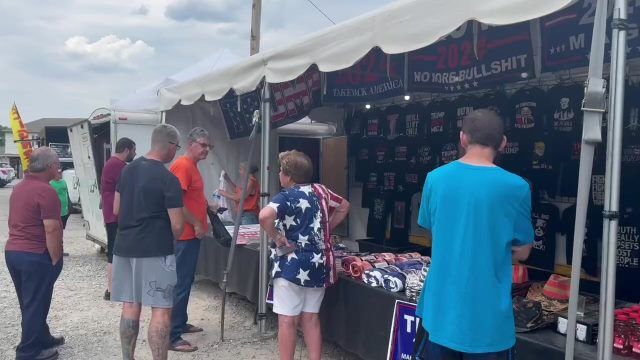 Sputnik People are standing in line to buy merchandise with Trump