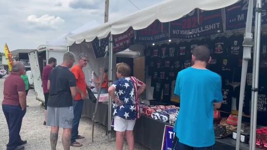Sputnik People are standing in line to buy merchandise with Trump