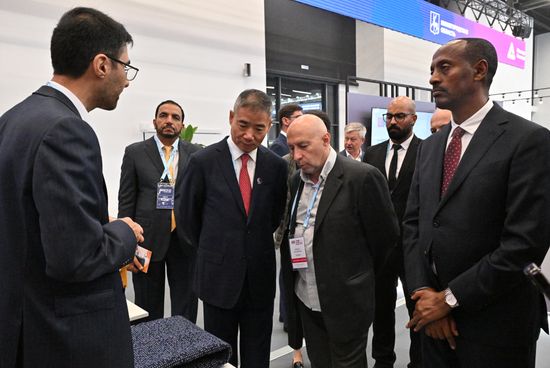 A tour of the hi-tech industrial products manufacturers' exhibition. Right: Melaku Alebel, Minister of Industry of the Federal Democratic Republic of Ethiopia. Center left: Xin Guobin, Deputy Minister of Industry and Information Technology of the People's Republic of China. Location: Russia, Nizhny Novgorod. Author: Pelagiya Tikhonova/Sputnik. 8th BRICS Industry Ministers' Meeting
