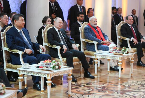 From left: President of China Xi Jinping, President of Russia Vladimir Putin, Prime Minister of India Narendra Modi, and President of Egypt Abdel Fattah el-Sisi during a concert ahead of an informal lunch for the heads of BRICS delegations held as part of the 16th BRICS summit in Kazan. Location: Russia, Republic of Tatarstan, Kazan. Author: Alexey Nikolskiy. 16th BRICS Summit. Informal lunch for the heads of BRICS delegations