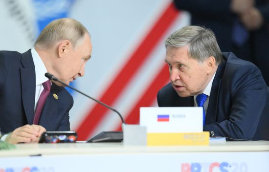 Russian President Vladimir Putin and Presidential Aide Yury Ushakov, right, during an expanded format meeting of heads of delegations at the 16th BRICS Summit in Kazan, Republic of Tatarstan, Russia. Location: Russia, Republic of Tatarstan, Kazan. Author: Stanislav Krasilnikov. 16th BRICS summit. Expanded meeting of BRICS heads of delegation