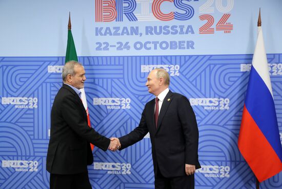 16th BRICS Summit. President of Russia Vladimir Putin meets with President of Iran Masoud Pezeshkian