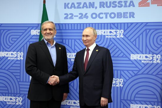 16th BRICS Summit. President of Russia Vladimir Putin meets with President of Iran Masoud Pezeshkian