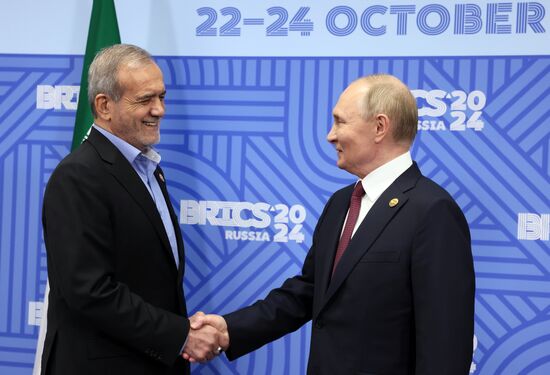 16th BRICS Summit. President of Russia Vladimir Putin meets with President of Iran Masoud Pezeshkian