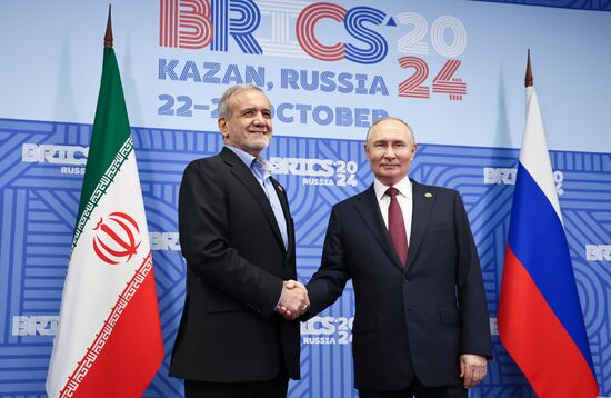 16th BRICS Summit. President of Russia Vladimir Putin meets with President of Iran Masoud Pezeshkian