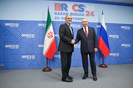 16th BRICS Summit. President of Russia Vladimir Putin meets with President of Iran Masoud Pezeshkian