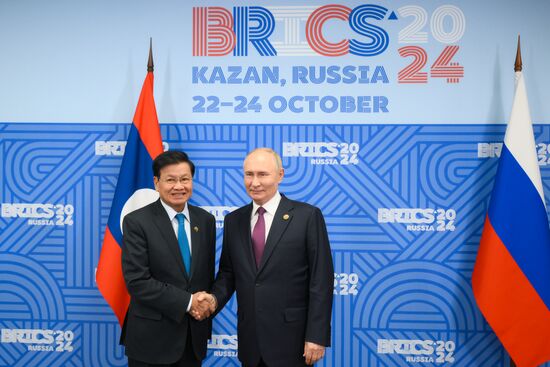 16th BRICS Summit. President of Russia Vladimir Putin meets with President of Laos Thongloun Sisoulith