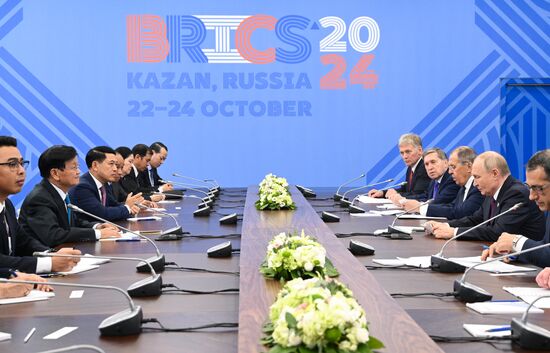 16th BRICS Summit. President of Russia Vladimir Putin meets with President of Laos Thongloun Sisoulith