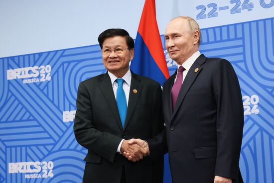 16th BRICS Summit. President of Russia Vladimir Putin meets with President of Laos Thongloun Sisoulith