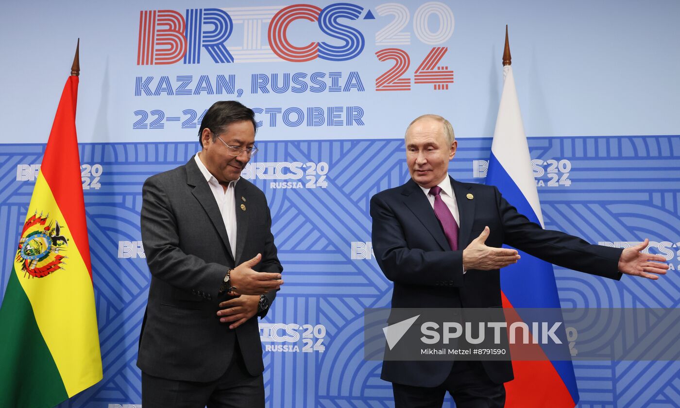 16th BRICS Summit. Meeting of President of Russia Vladimir Putin with President of Bolivia Luis Alberto Arce Catacora