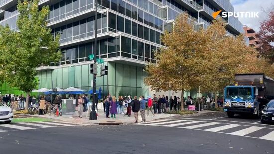 People queue at one of the polling stations in downtown Washington