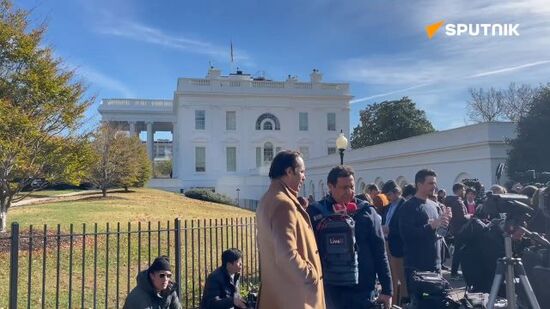 Journalists gather outside the White House in anticipation of US President-elect Donald Trump's meeting with outgoing leader Joe Biden