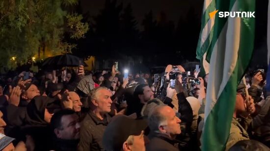 People gather at the square in front of Abkhaz President Aslan Bzhania's office following the news of his resignation