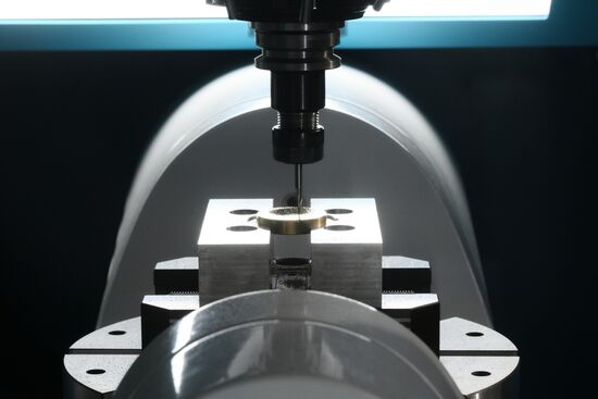 The 4th Young Scientists Congress. Engraving of a brass medallion on the Beaverteh machine at the Nasha Lab stand. Location: Russia, Federal territory 'Sirius'. Author: Ekaterina Chesnokova. 4th Young Scientists Congress