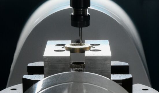 The 4th Young Scientists Congress. Engraving of a brass medallion on the Beaverteh machine at the Our Lab stand. Location: Russia, Federal territory 'Sirius'. Author: Ekaterina Chesnokova. 4th Young Scientists Congress