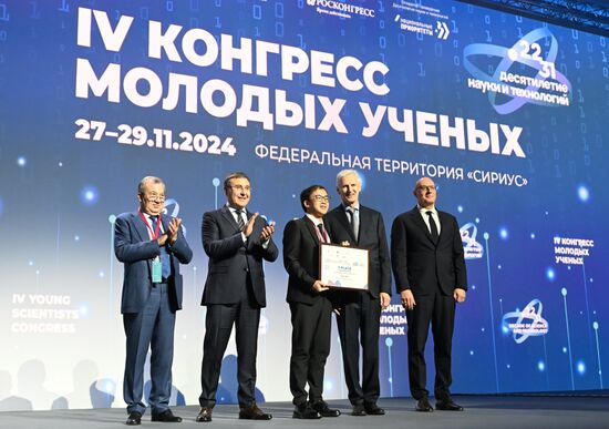 The 4th Young Scientists Congress. Plenary session. Winners of the BRICS Contest of Young Innovators announced. Award ceremony. From left: Gennady Krasnikov, President of the Russian Academy of Sciences; Valery Falkov, Minister of Science and Higher Education of the Russian Federation; Yuen Wu, innovator, China; Andrei Fursenko, Aide to the President of the Russian Federation; Dmitry Chernyshenko, Deputy Prime Minister of the Russian Federation. Location: Russia, Federal territory 'Sirius'. Author: Ilya Pitalev. 4th Young Scientists Congress. Plenary session