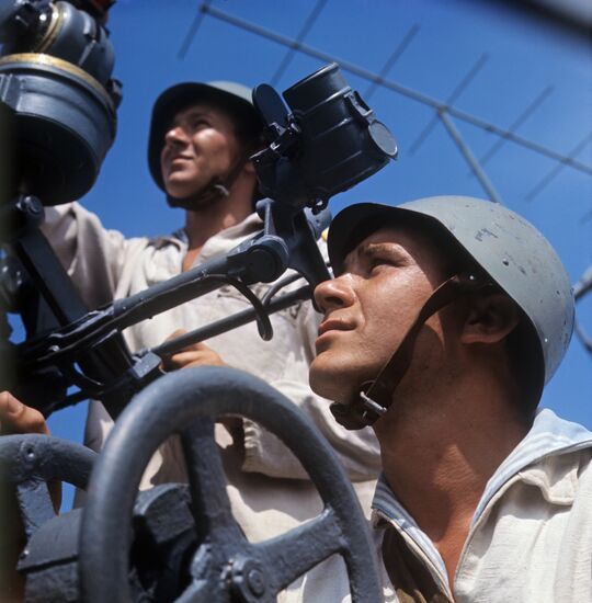USSR Armed Forces anti-aircraft gunners crew on warship during tactical exercises