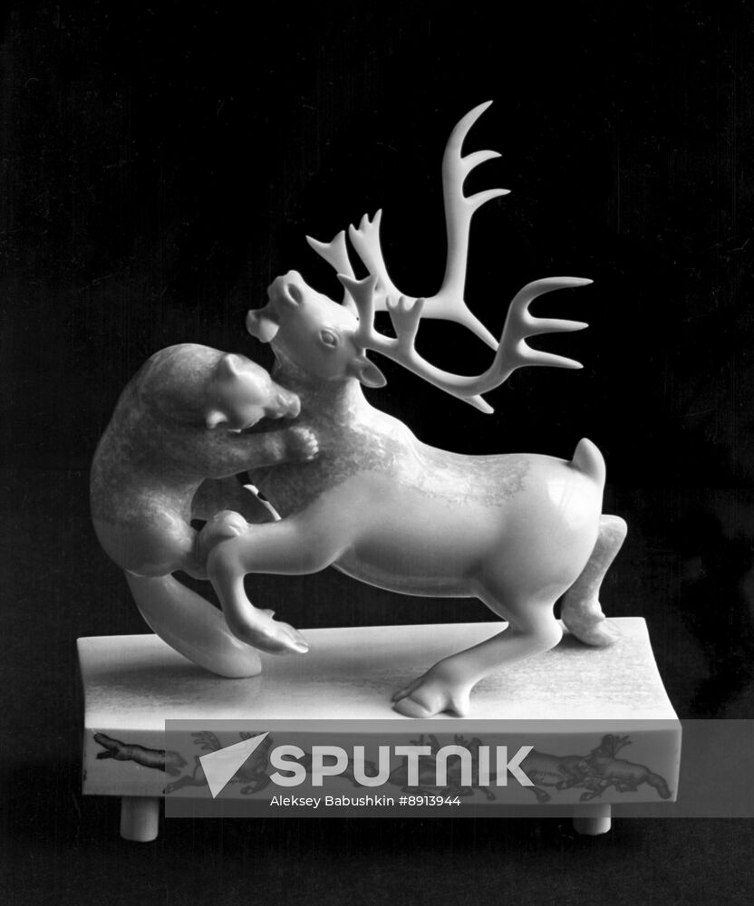 Deer and Wolf sculpture by bone carvers