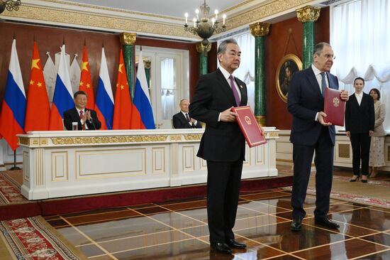 May 8, 2025. Russian Foreign Minister Sergei Lavrov and Wang Yi, Member of the Political Bureau of the CPC Central Committee, Director of the Office of the Central Commission for Foreign Affairs during a ceremony of exchanging documents after Russia-China talks. Back: President of Russia Vladimir Putin and President of China Xi Jinping. Location: Russia, Moscow. Author: Alexei Danichev/Sputnik. President of China Xi Jinping's official visit to Russia