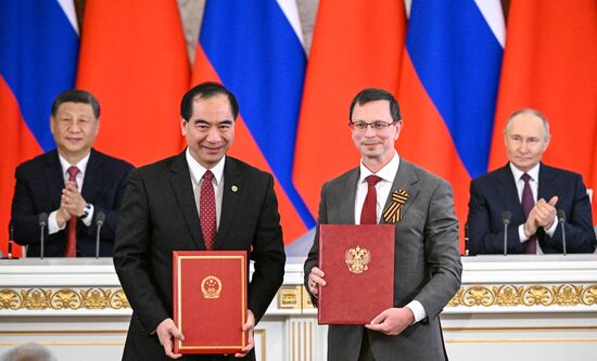 May 8, 2025. Center, right: Nikita Anisimov, Member of the Human Rights Council (HRC), Rector of the National Research University Higher School of Economics (HSE) at the ceremony of exchanging documents following Russia-China talks. Background: Russian President Vladimir Putin and Chinese President Xi Jinping, left. Location: Russia, Moscow. Author: Sergey Bobylev/Sputnik. President of China Xi Jinping's official visit to Russia