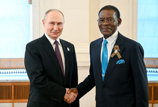 President of Russia Vladimir Putin and President of the Republic of Equatorial Guinea Teodoro Obiang Nguema Mbasogo, who arrived in the Kremlin for a gala concert for heads of foreign delegations attending the 80th anniversary of Victory in the Great Patriotic War. Location: Russia, Moscow. Author: Sergey Bobylev/Sputnik. Heads of foreign delegations arrive in Kremlin for gala concert