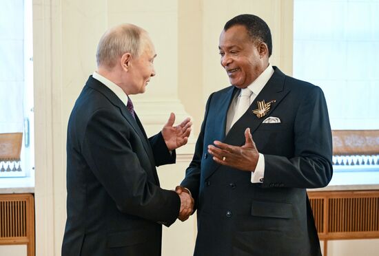 President of Russia Vladimir Putin and President of the Republic of the Congo Denis Sassou-Nguesso, who arrived in the Kremlin for a gala concert held for heads of foreign delegations invited to the celebrations of the 80th anniversary of Victory in the Great Patriotic War. Location: Russia, Moscow. Author: Sergey Bobylev/Sputnik. Heads of foreign delegations arrive in Kremlin for gala concert