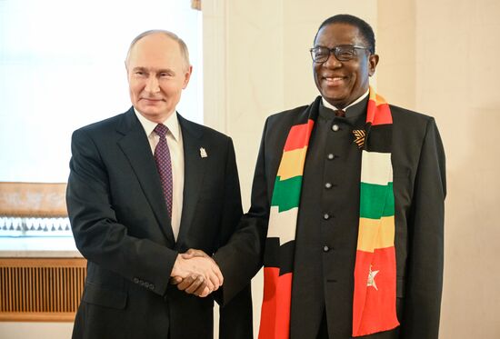 President of Russia Vladimir Putin and President of the Republic of Zimbabwe Emmerson Mnangagwa, who arrived in the Kremlin for a gala concert held for heads of foreign delegations invited to the celebrations of the 80th anniversary of Victory in the Great Patriotic War. Location: Russia, Moscow. Author: Sergey Bobylev/Sputnik. Heads of foreign delegations arrive in Kremlin for gala concert