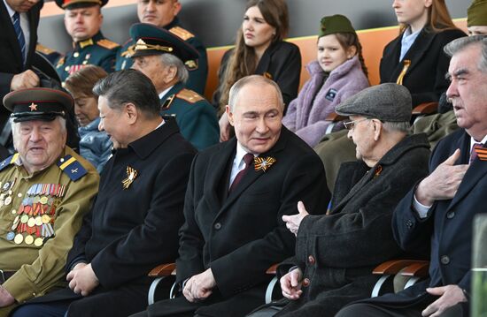 President of Russia Vladimir Putin and President of China Xi Jinping on Red Square in Moscow during the military parade to mark the 80th anniversary of Victory. On May 9, Russia celebrates the 80th anniversary of Victory in the Great Patriotic War of 1941-1945. Left: Great Patriotic War veteran Yevgeny Znamensky. From right: President of Tajikistan Emomali Rahmon and Great Patriotic War veteran Ivan Martynushkin. Location: Russia, Moscow. Author: Sergey Bobylev/Sputnik. President of Russia Vladimir Putin and foreign leaders at military parade marking 80th anniversary of Victory