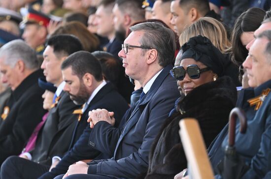 Guests on the stand on Red Square in Moscow at the military parade to mark the 80th anniversary of Victory. On May 9, Russia celebrates the 80th anniversary of Victory in the Great Patriotic War of 1941-1945. Center: President of Serbia Aleksandar Vucic. Location: Russia, Moscow. Author: Ilya Pitalev/Sputnik. President of Russia Vladimir Putin and foreign leaders at military parade marking 80th anniversary of Victory